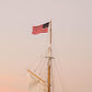 American Flag Sailboat Print – Nantucket Coastal Wall Art, Nautical Photography, Patriotic Ocean Decor, Summer Seascape Photo
